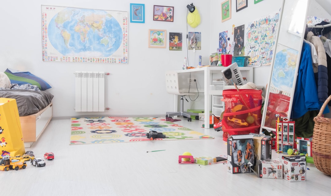 A cozy and well-organized baby room with a crib, soft lighting, and playful decor.