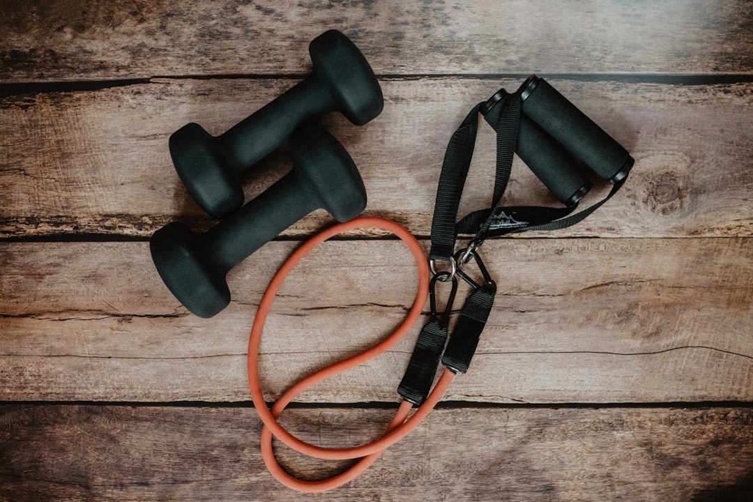 A person exercising at home with simple equipment, showcasing a healthy lifestyle and movement.