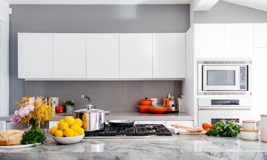 A well-organized kitchen with neatly arranged utensils, spices, and food items, showcasing a clean and efficient cooking space.